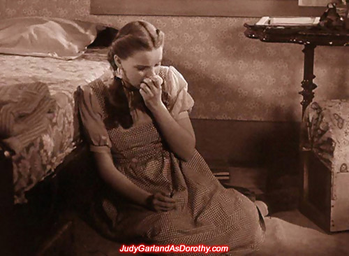 Judy Garland as Dorothy is left in tears inside her bedroom