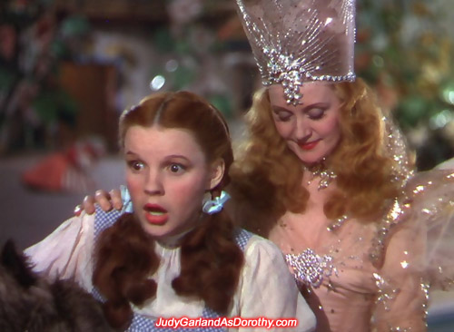 Judy Garland as Dorothy is shocked after Glinda gives her the ruby slippers