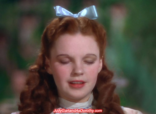 Judy Garland as Dorothy closes her eyes and thinking to herself 'There's no place like home'